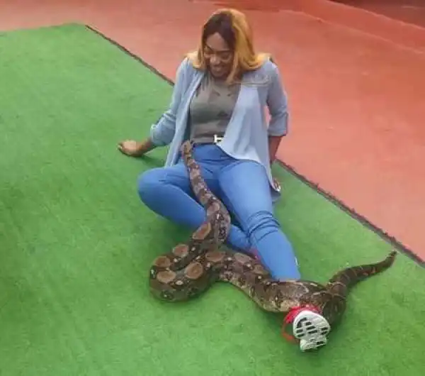 Unbelievable! Nigerian Actress Caught Playing with Lions and Romancing a Snake in South Africa (Videos)